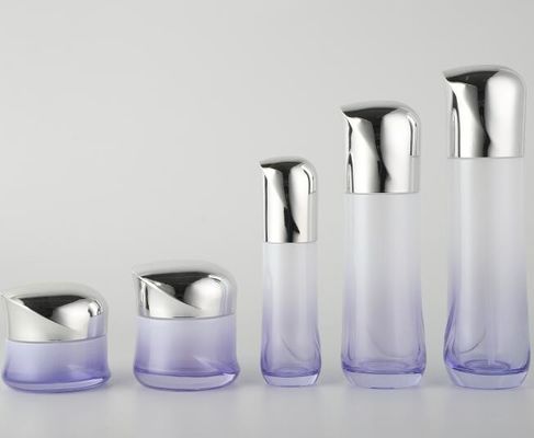 Роскошные стеклянные косметические бутылки с покрытыми крышками/лосьоном опарника сливк разливают косметическую упаковку по бутылкам